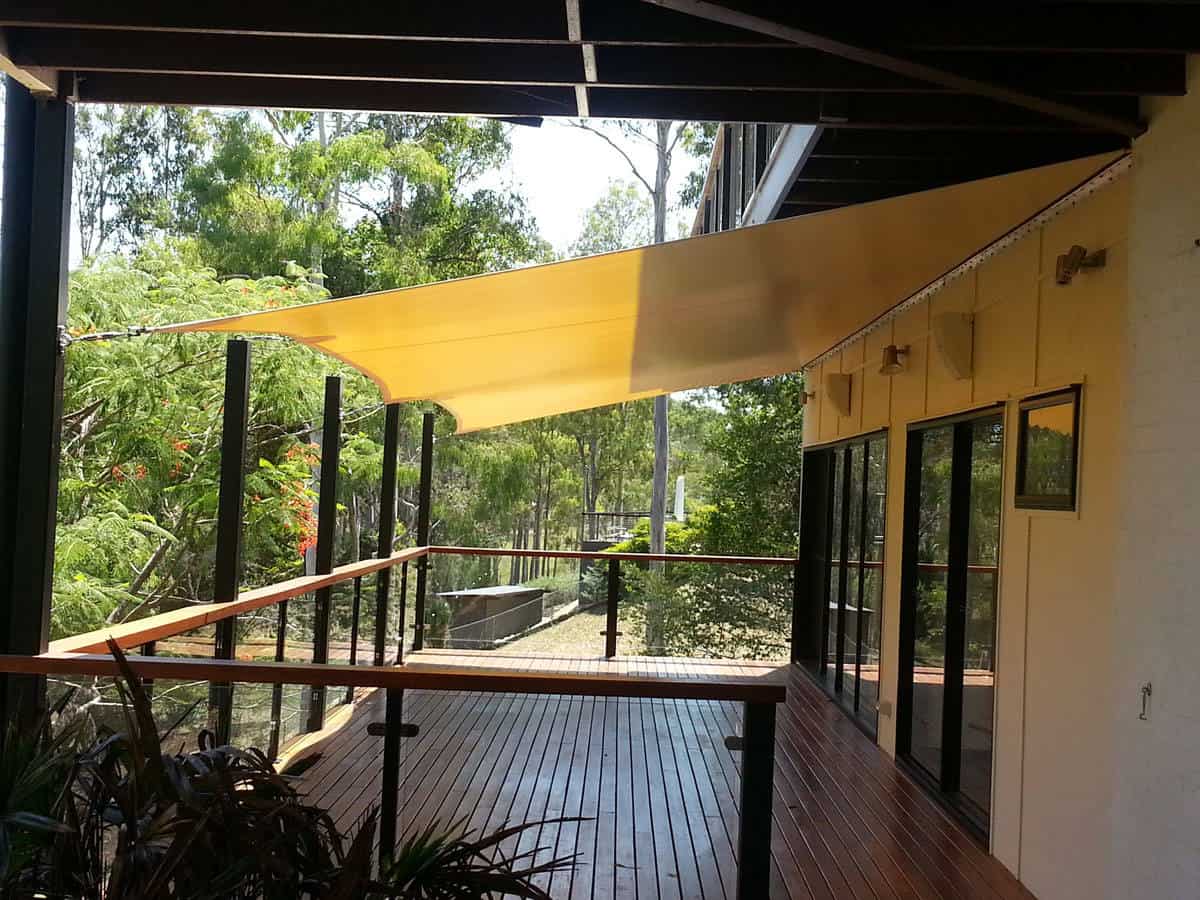Sun shade sail over verandah