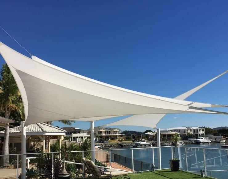 Shade sail installation at Newport, Brisbane. Canal lifestyle sails in Rainbow Shade - Ice white Z-16 fabric.