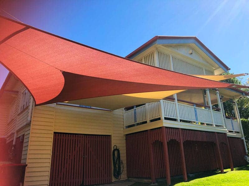 Twin Carport Overlapping Shade Sails for this Queenslander home in Morningside, Brisbane south using the Z-16 Rainbow Shade.