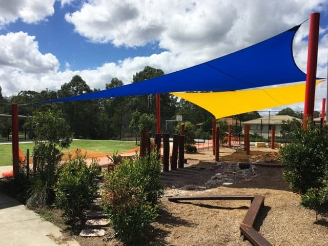 Colourful shade sail installation at St Stephens School, Algester by Superior Shade Sails.