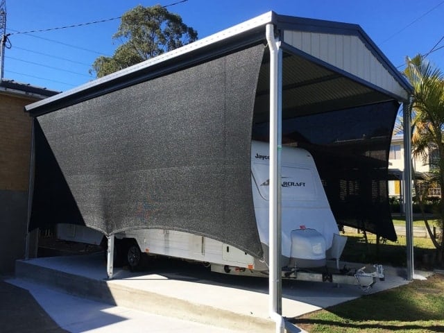Goodna - carport sun sail - in black abshade material - 316 marine grade wire and rigging - creating vertical block out screens.