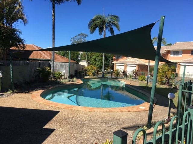 Pool shade sail in 330gsm extrablock material - Springfield installed by Superior Shade Sails.