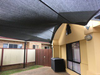 7 point sail carport shade sail in Kuraby, Brisbane in Z -16 7 point sail carport shade sail in Kuraby, Brisbane in Z -16 charcoal with black powder coated posts.
