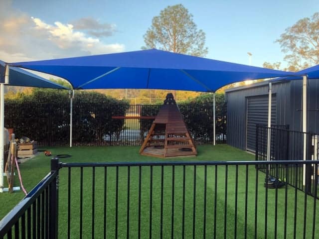 Replacement Shade Sail for Childcare Centre, Dayboro, installed by Superior Shade Sails using a 4 hip and ridge framed shade sail in z-16 fabric.