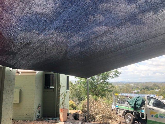 Carport Shade Sail installed at Pullenvale, Brisbane on a very steep block installed by Superior Shade Sails, Brisbane