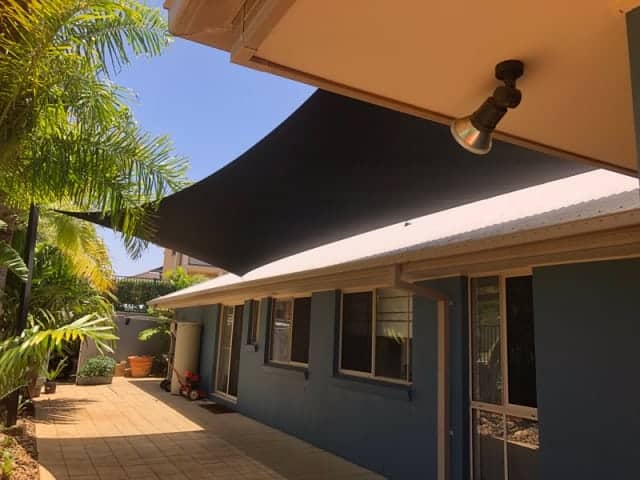 4 point hyper shade sail to keep the heat out of a secluded outdoor space in Redland Bay.