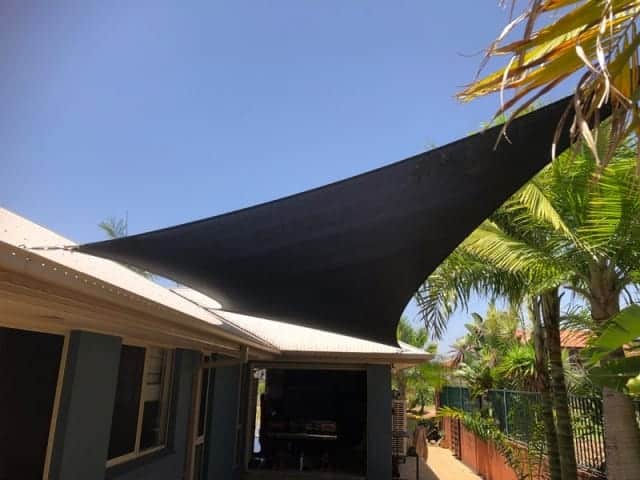 4 point hyper shade sail to keep the heat out of a secluded outdoor space in Redland Bay.