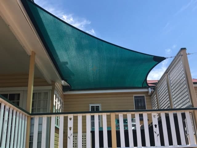 Patio Shade Sail -To keep the family BBQ out of the sun for this Queenslander in Nundah, Brisbane.We used the Rainbow Z-16 sail fabric in the colour Rainforest and 316 marine grade trace wire with two roof brackets attached.