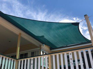 Patio Shade Sail -To keep the family BBQ out of the sun for this Queenslander in Nundah, Brisbane.We used the Rainbow Z-16 sail fabric in the colour Rainforest and 316 marine grade trace wire with two roof brackets attached.