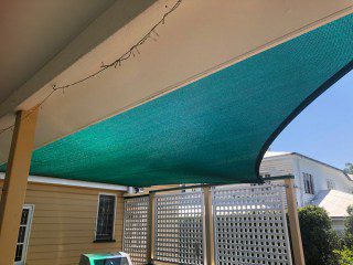 Patio Shade Sail -To keep the family BBQ out of the sun for this Queenslander in Nundah, Brisbane.We used the Rainbow Z-16 sail fabric in the colour Rainforest and 316 marine grade trace wire with two roof brackets attached.