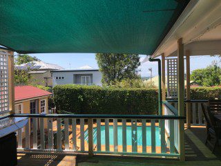 Patio Shade Sail -To keep the family BBQ out of the sun for this Queenslander in Nundah, Brisbane.We used the Rainbow Z-16 sail fabric in the colour Rainforest and 316 marine grade trace wire with two roof brackets attached.