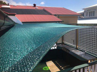 Patio Shade Sail -To keep the family BBQ out of the sun for this Queenslander in Nundah, Brisbane.We used the Rainbow Z-16 sail fabric in the colour Rainforest and 316 marine grade trace wire with two roof brackets attached.