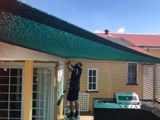 Patio Shade Sail - To keep the family BBQ out of the sun for this Queenslander in Nundah, Brisbane.We used the Rainbow Z-16 sail fabric in the colour Rainforest and 316 marine grade trace wire with two roof brackets attached.