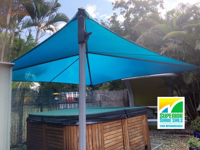 Replacement shade sails over the Spa and Driveway for this home at Pallara in the lovely Z-16 Turquoise using Hyp and ridge structures. Spa is looking good