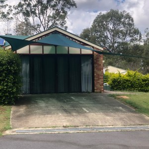 Driveway Shade Sail in New Beith in Z16 Rainforest Green installed by Superior Shade Sail Brisbane