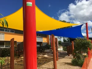 Bright coloured replacement shade shade sails for this school installed by Superior Shade Sails in Brisbane using commercial fabric.
